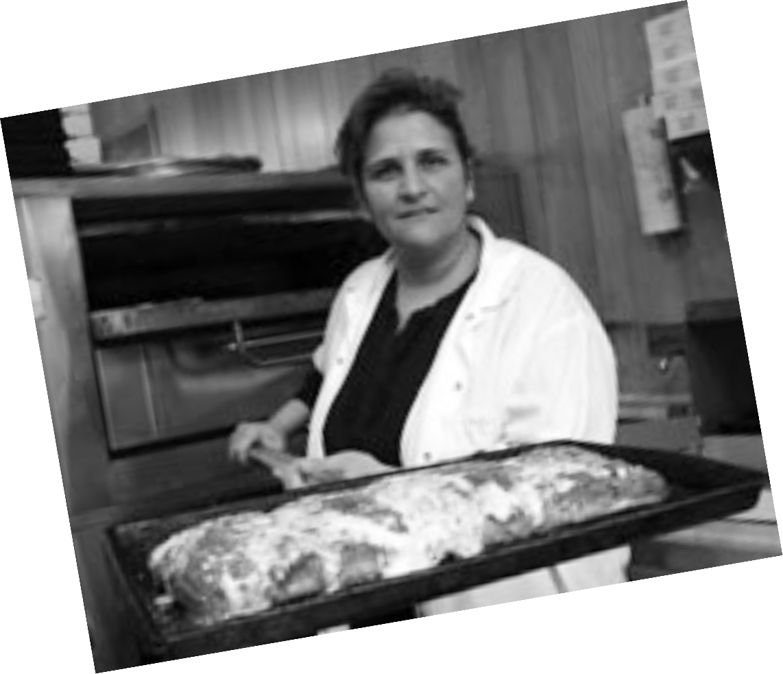 Portrait of a woman holding out a pizza